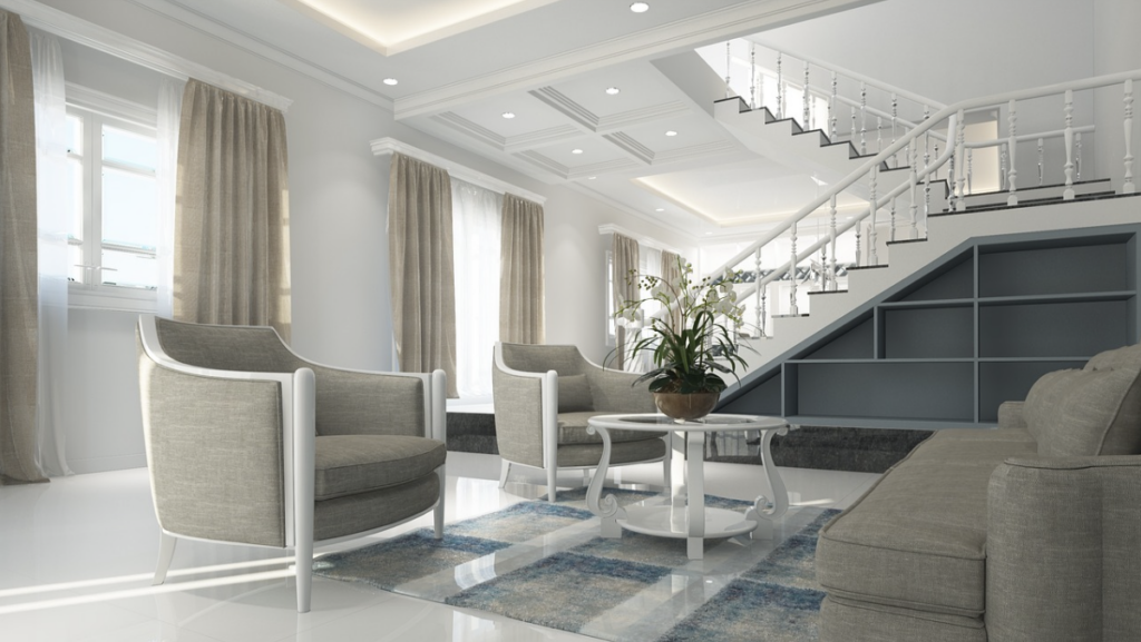 Salon de luxe vaste et moderne dans un ton gris avec un escalier en arrière-plan